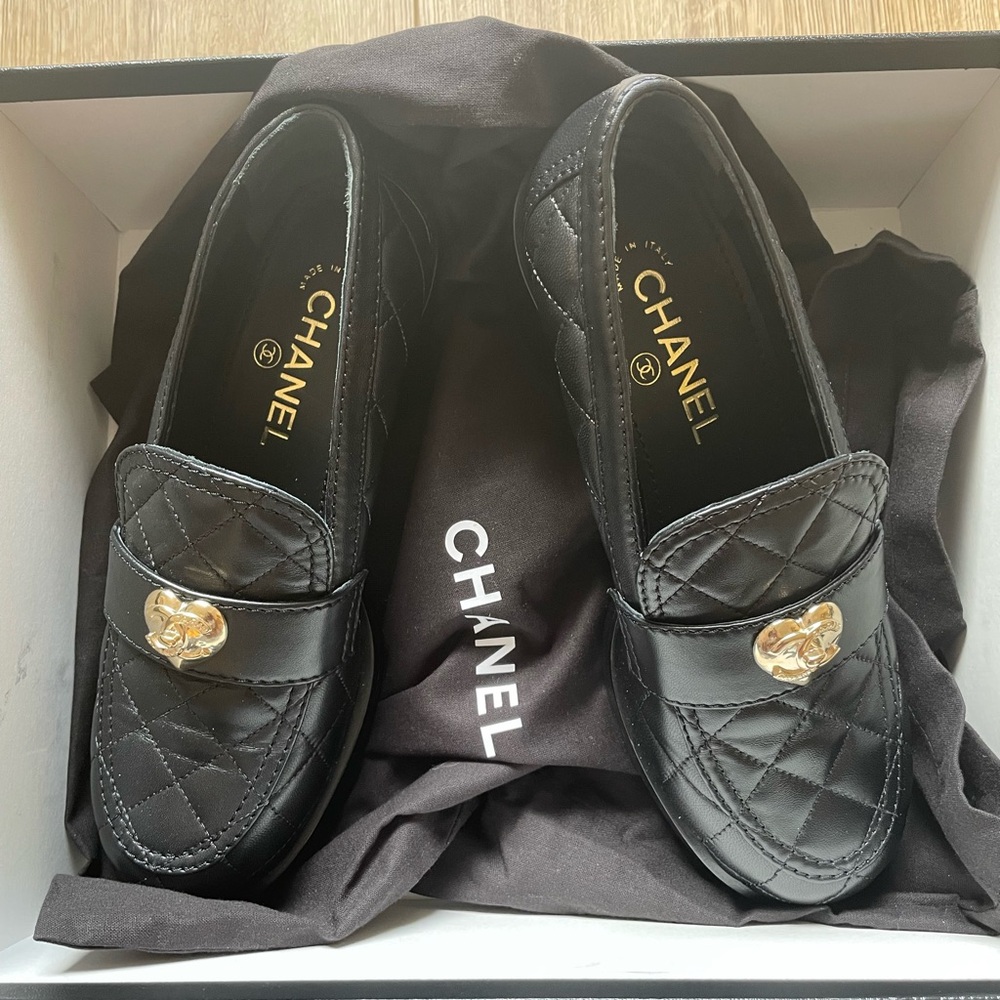 CHANEL Black Quilted Loafers with Gold Accent